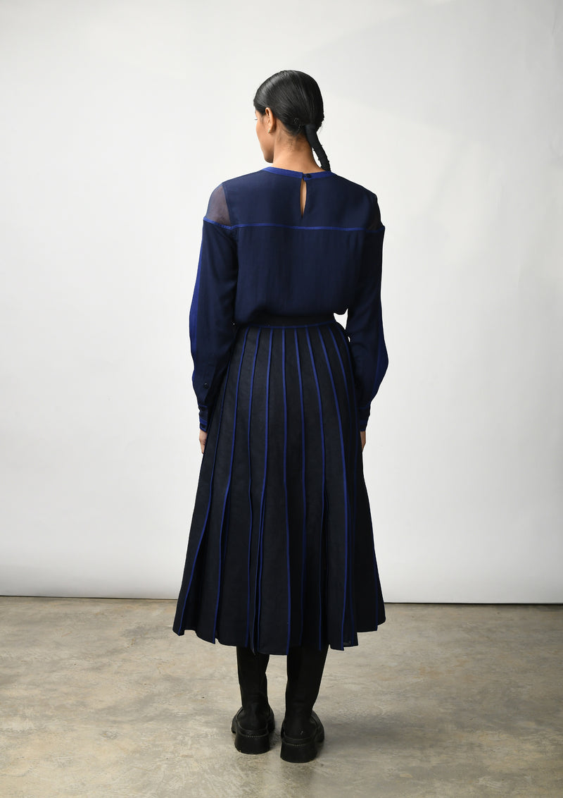 Flare skirt with hand bound pleats