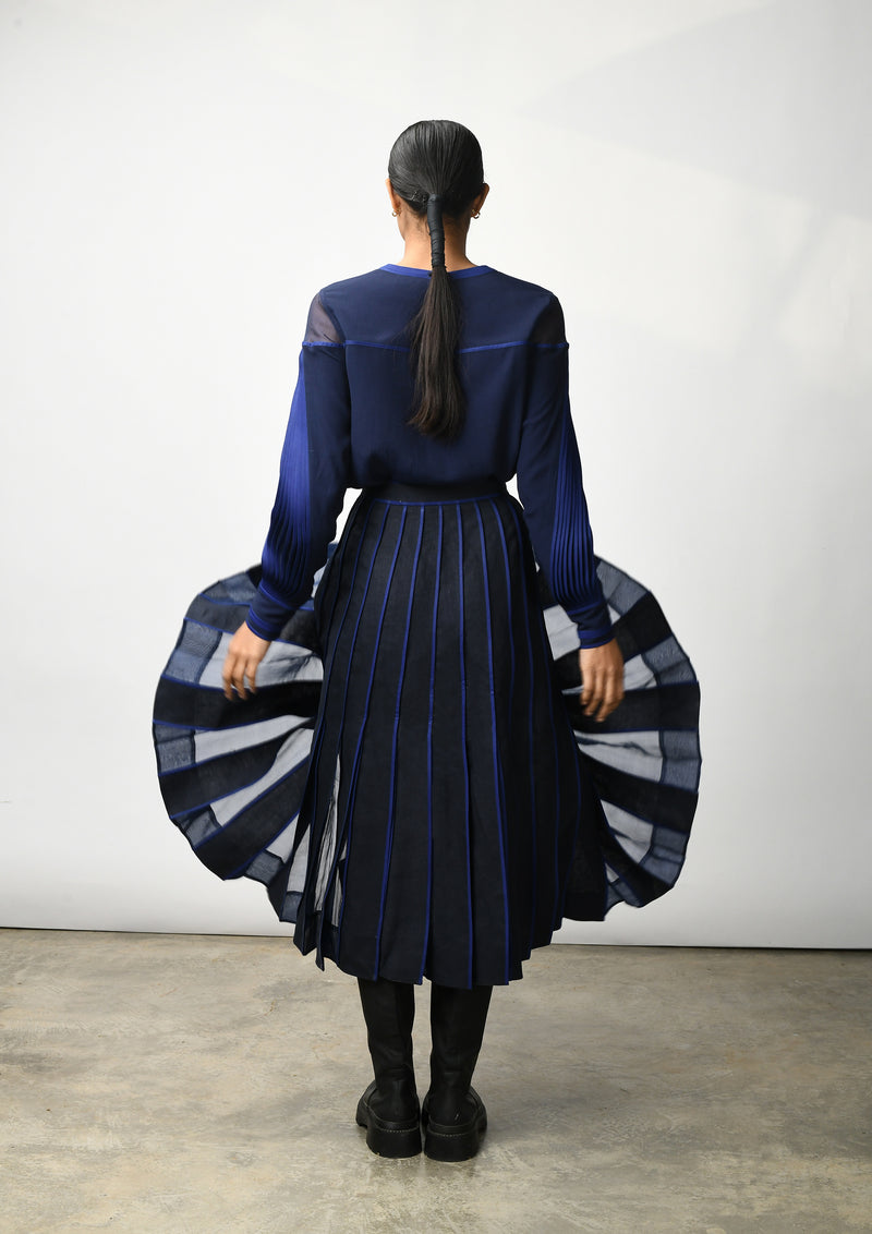 Flare skirt with hand bound pleats