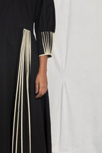 V-neck pleated dress with cuff binding