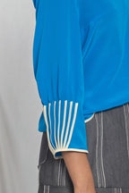 V-neck top with cuff binding detail