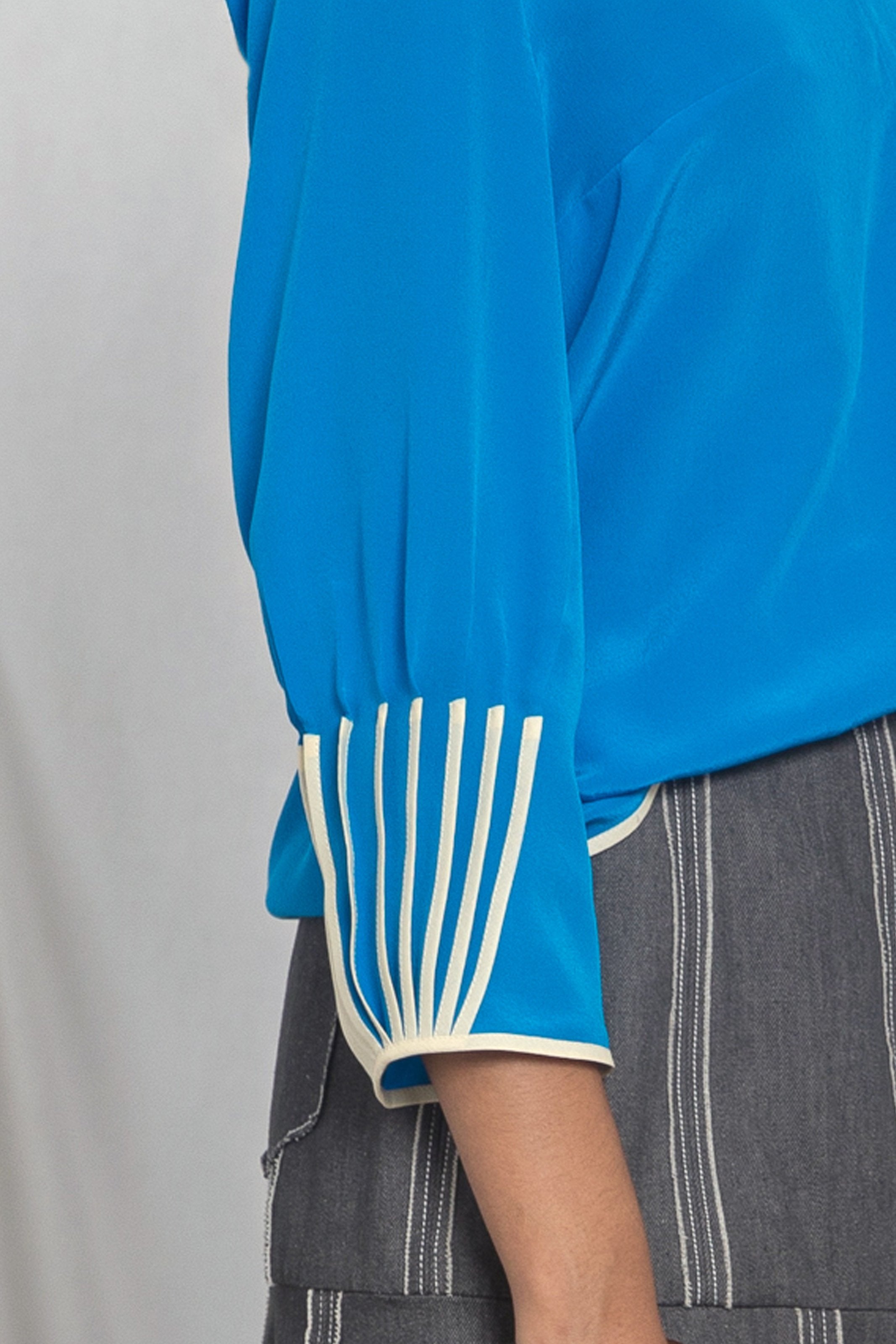 V-neck top with cuff binding detail